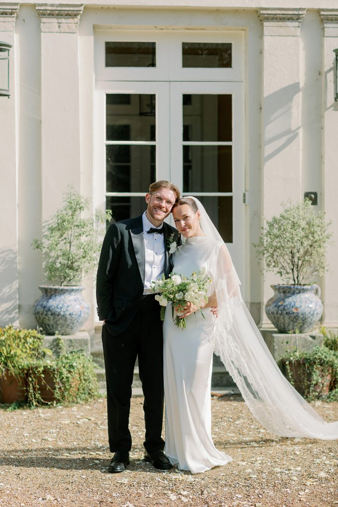 Bride and groom portrait outside Ripple Court Estate wedding venue in Kent