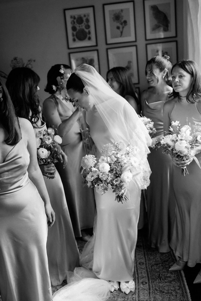 Bride with bridesmaids during morning preparations at Ripple Court Estate wedding in Kent