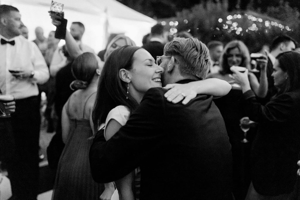 Bride hugging groom on the dance floor during evening reception at Ripple Court Estate wedding in Kent