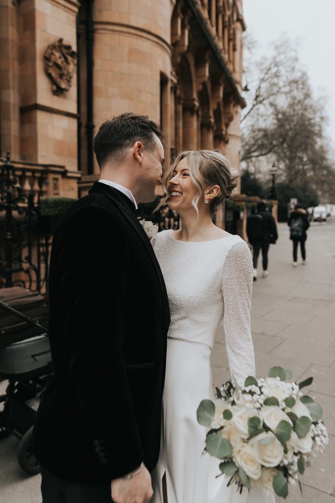 Bride and groom portrait at Kimpton Fitzroy London, featuring a modern French twist hairstyle and soft natural glowing bridal makeup
